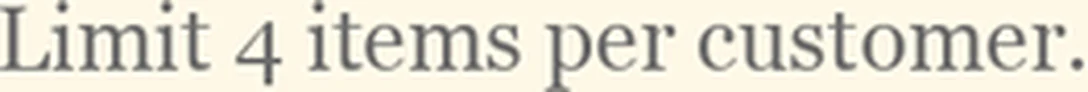 A line of price-tag fine print cut from the original and scaled up, the letters soft